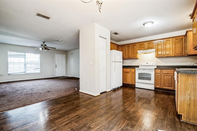 kitchen with white appliances, a textured ceiling, ceiling fan, and dark wood-type flooring