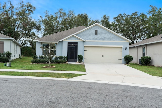 view of front facade featuring a garage and a front yard