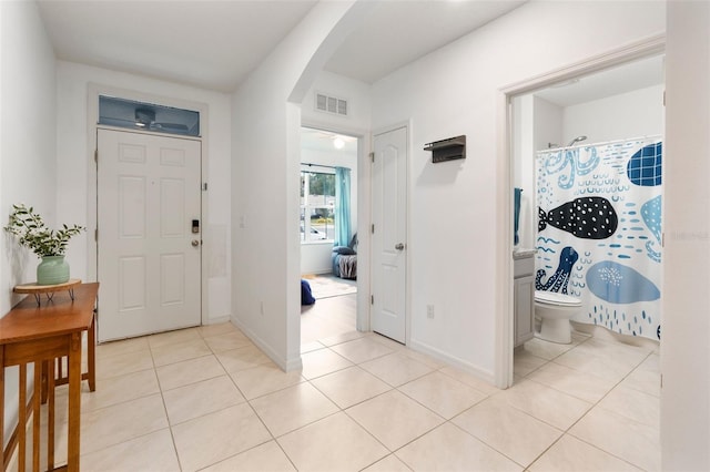 entryway featuring light tile patterned floors