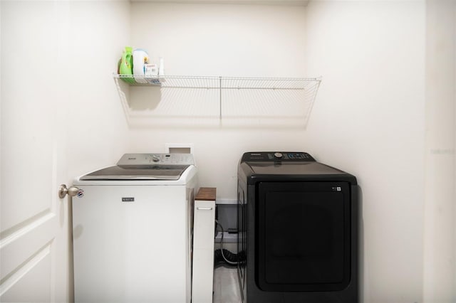 washroom with washer and clothes dryer