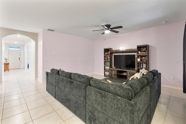 living room with ceiling fan and light tile patterned flooring