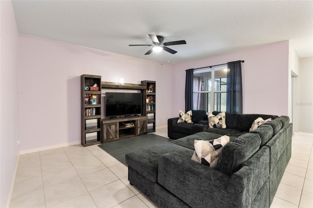 tiled living room featuring a textured ceiling and ceiling fan