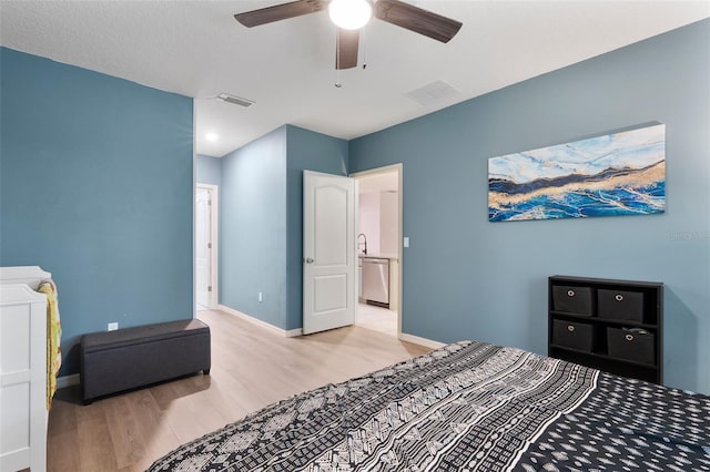 bedroom with ceiling fan and light hardwood / wood-style floors