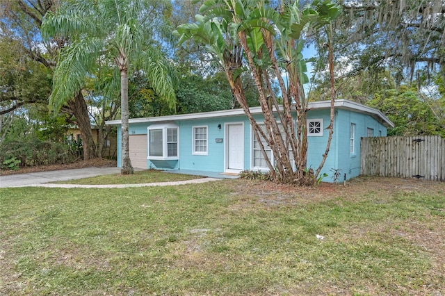 ranch-style home with a front lawn