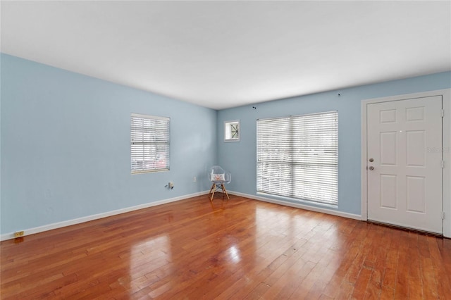 spare room featuring hardwood / wood-style flooring