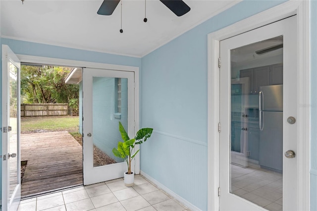 doorway to outside with ceiling fan, light tile patterned floors, and french doors