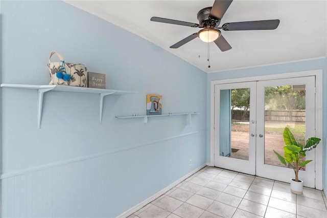 doorway to outside with ceiling fan, light tile patterned flooring, french doors, vaulted ceiling, and crown molding