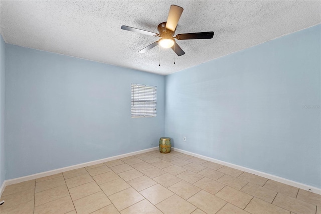 spare room featuring a textured ceiling and ceiling fan