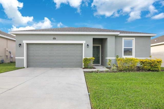 ranch-style house featuring a front lawn and a garage