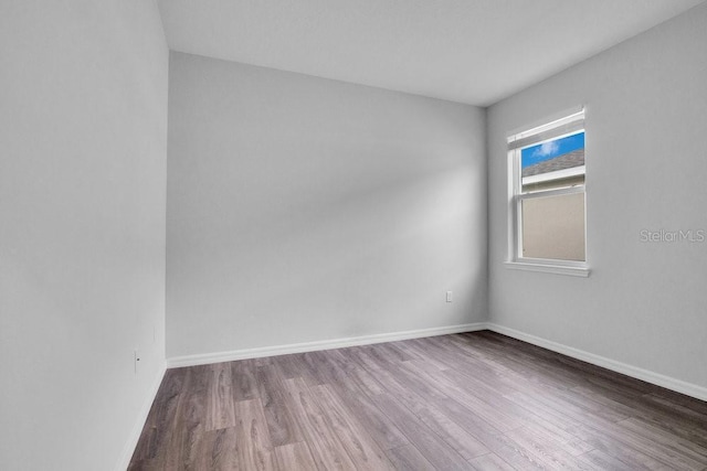 empty room featuring hardwood / wood-style floors