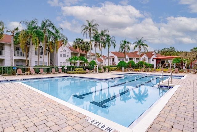 view of swimming pool with a patio