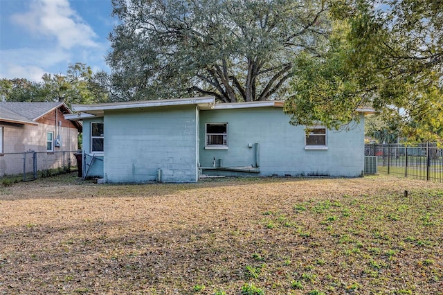 back of house with cooling unit