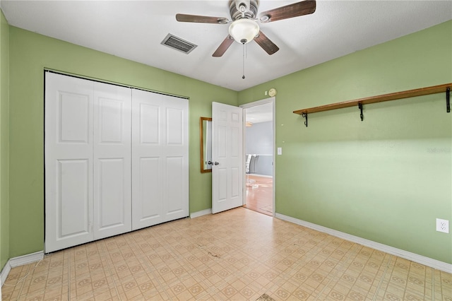 unfurnished bedroom featuring light floors, baseboards, visible vents, and a closet