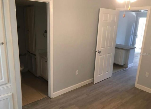 unfurnished bedroom with hardwood / wood-style floors