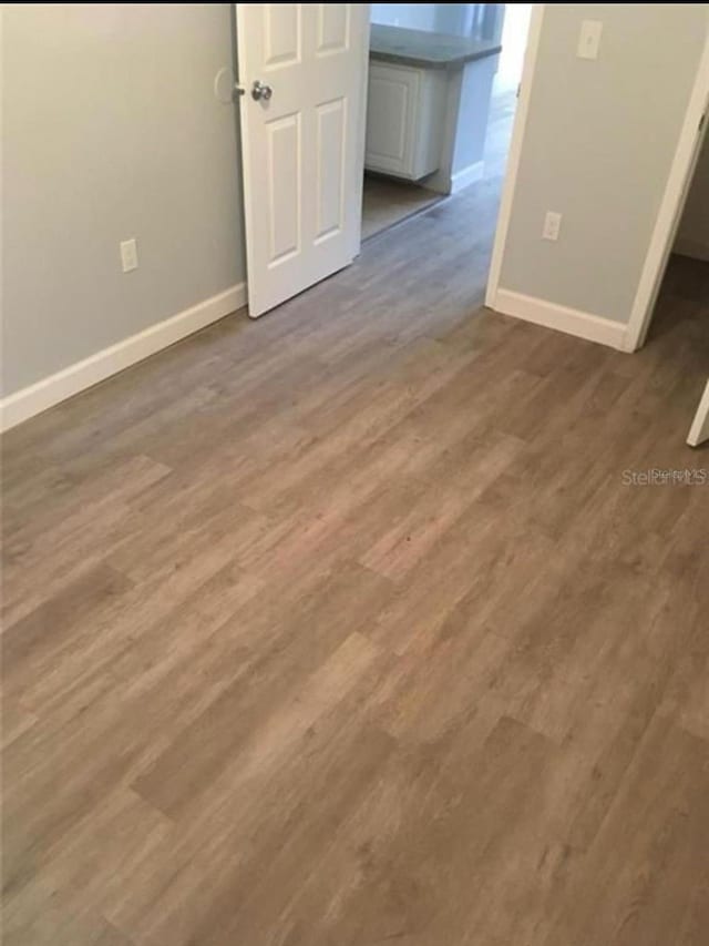 empty room featuring hardwood / wood-style floors