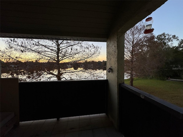 view of balcony at dusk