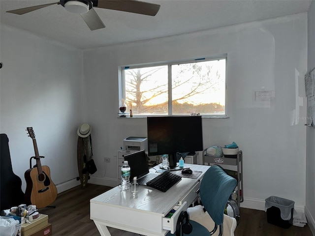 office featuring dark wood-type flooring, baseboard heating, and ceiling fan