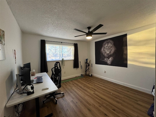 home office with ceiling fan, wood-type flooring, and a textured ceiling