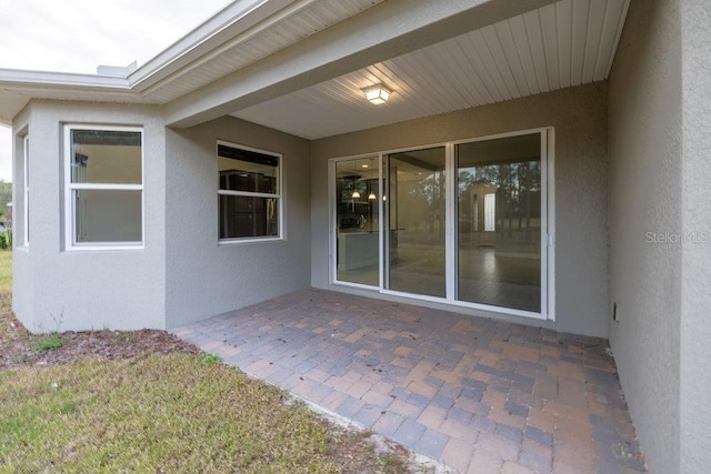 doorway to property with a patio area