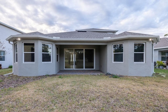 rear view of house with a lawn