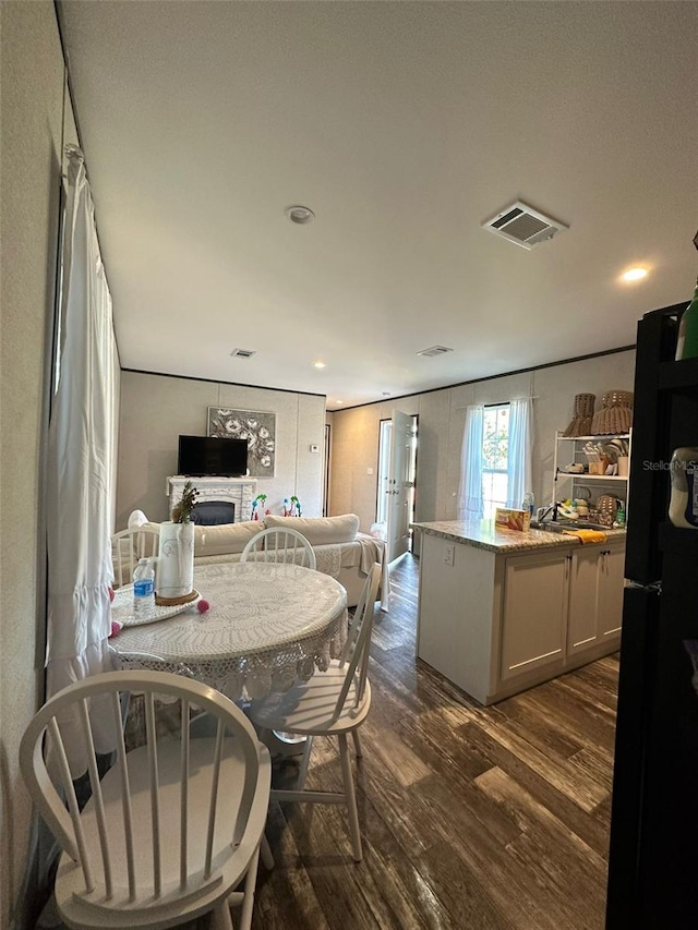 dining space with dark wood-type flooring