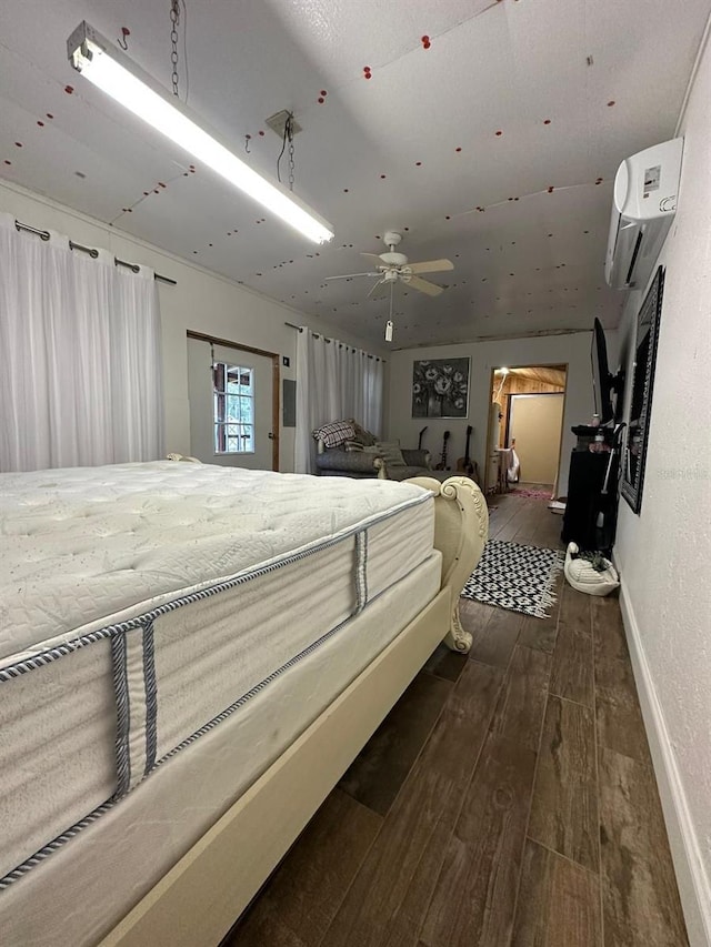 bedroom with an AC wall unit, dark hardwood / wood-style floors, and ceiling fan