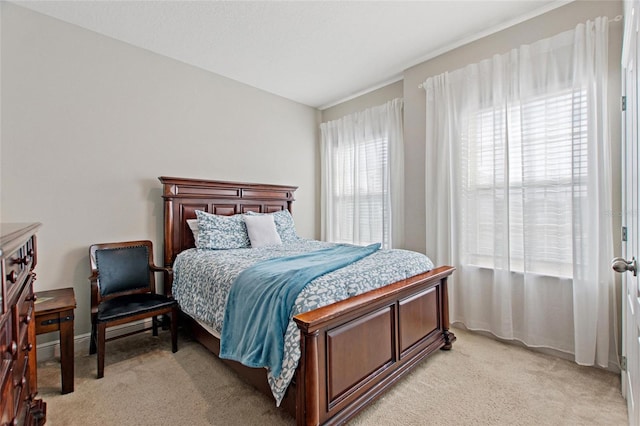 bedroom featuring light carpet