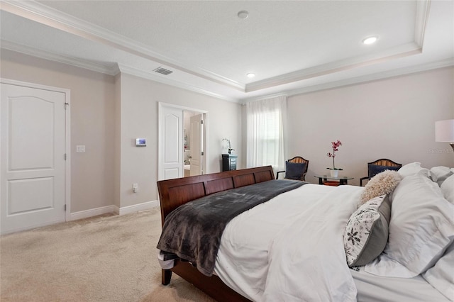 bedroom featuring light carpet, baseboards, visible vents, a tray ceiling, and crown molding