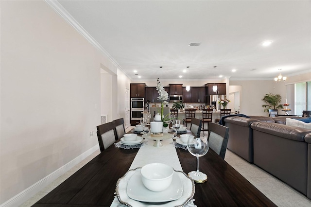 dining area with recessed lighting, visible vents, baseboards, ornamental molding, and an inviting chandelier