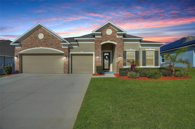 traditional-style home featuring a garage, stucco siding, a lawn, and concrete driveway