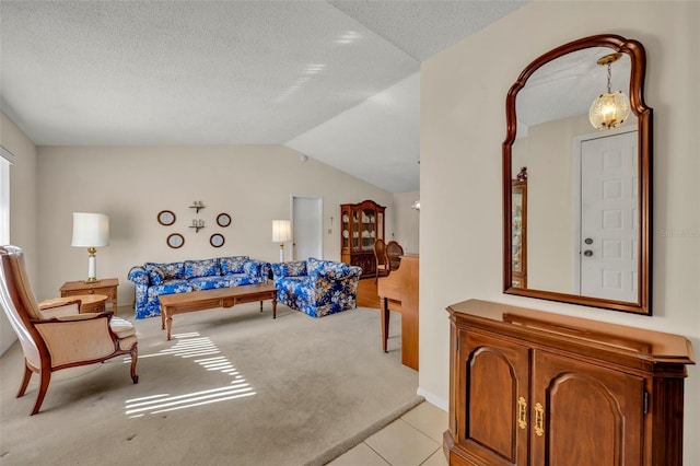 interior space with light colored carpet and vaulted ceiling