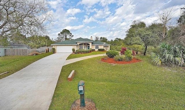 ranch-style home featuring a front lawn and a garage