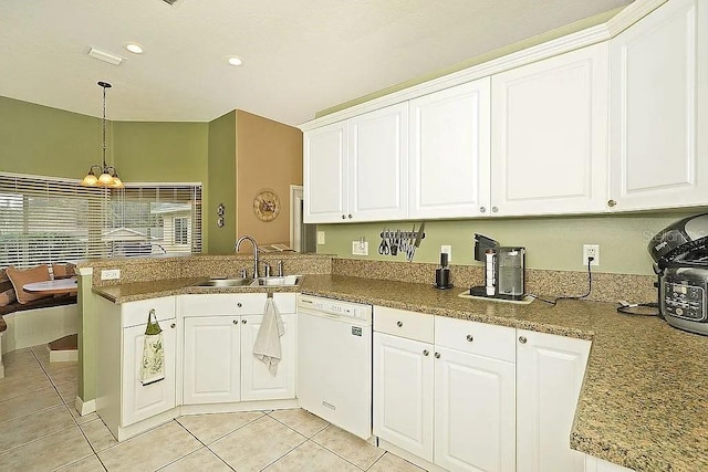 kitchen featuring white dishwasher, white cabinets, kitchen peninsula, and sink