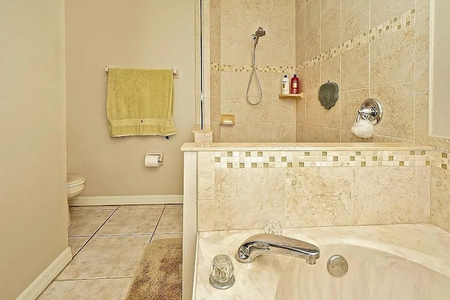 full bathroom featuring tile patterned flooring, baseboards, toilet, tiled shower, and a bath