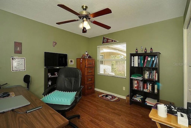 home office with dark wood-style floors, baseboards, a textured ceiling, and ceiling fan