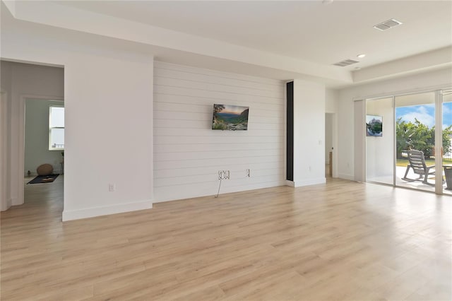 empty room with light hardwood / wood-style floors