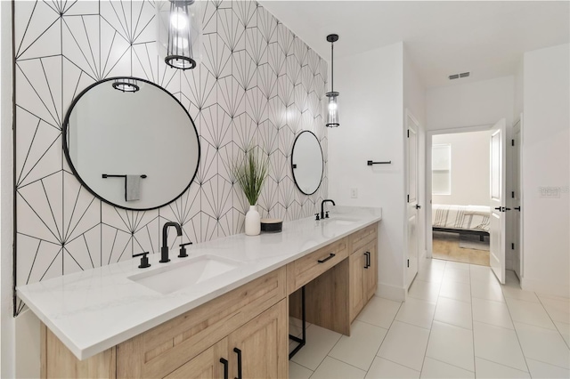 bathroom featuring tile walls, vanity, and tile patterned flooring