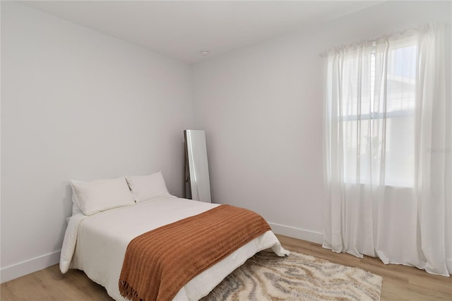 bedroom with light hardwood / wood-style floors