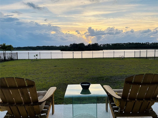 yard at dusk with a water view