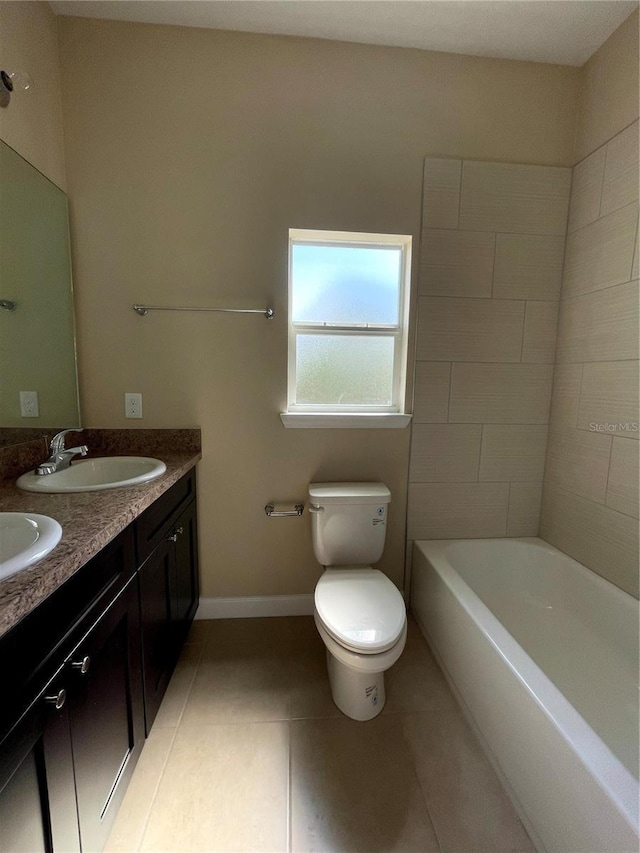 full bathroom featuring toilet, tile patterned floors, vanity, and  shower combination