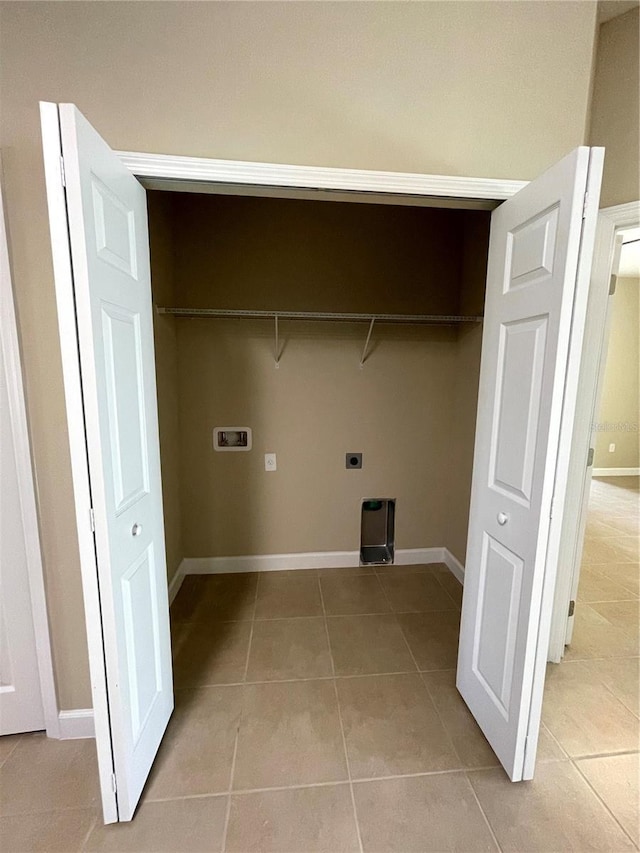 washroom featuring washer hookup, light tile patterned floors, and hookup for an electric dryer