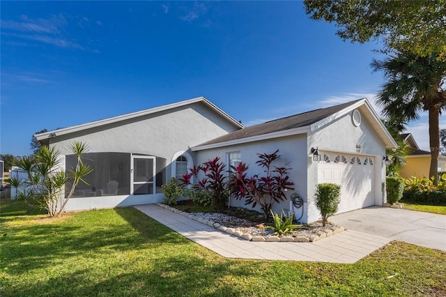 single story home featuring a front lawn, a garage, and a sunroom