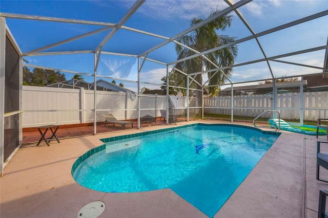 view of swimming pool with a lanai and a patio