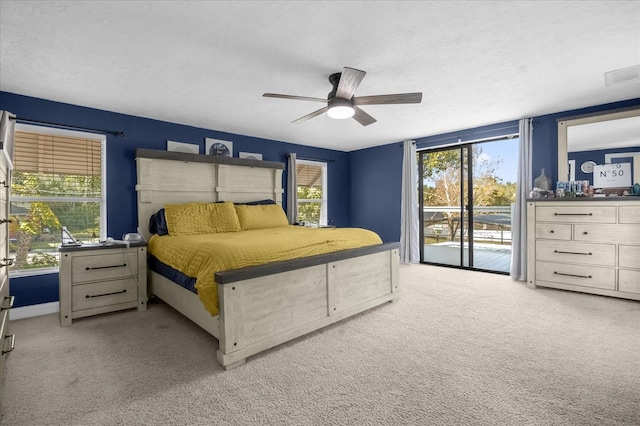 bedroom with visible vents, carpet flooring, ceiling fan, a textured ceiling, and access to outside