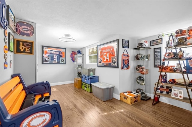 sitting room featuring wood finished floors and baseboards