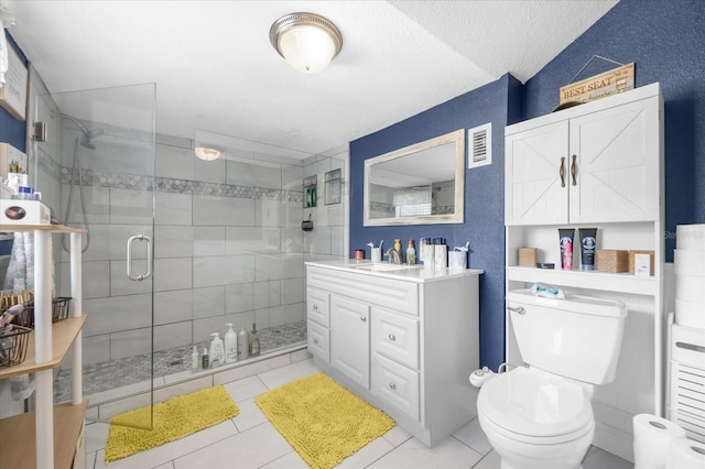 full bathroom featuring visible vents, toilet, a stall shower, vanity, and a textured ceiling