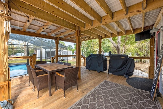 wooden terrace with glass enclosure, outdoor dining area, grilling area, and an outdoor pool