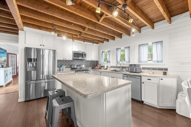 kitchen with stainless steel appliances, wooden ceiling, a sink, and dark wood-style flooring