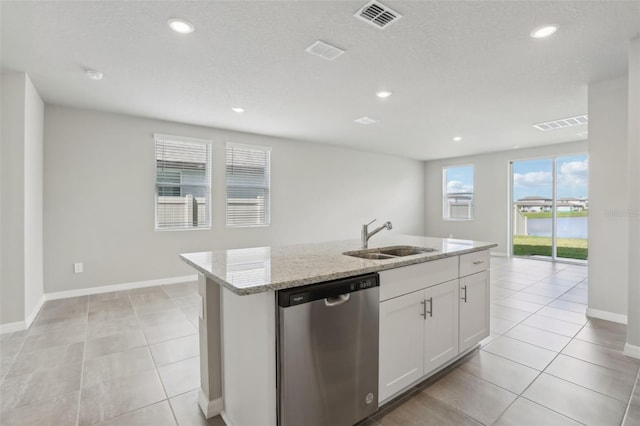 kitchen featuring a sink, visible vents, white cabinets, light stone countertops, and dishwasher