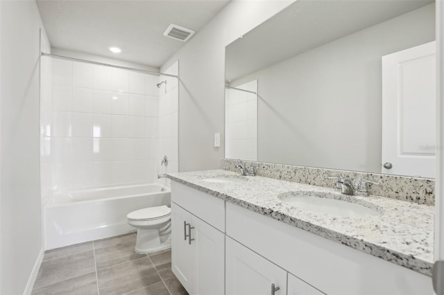 full bathroom with visible vents, a sink, toilet, and double vanity